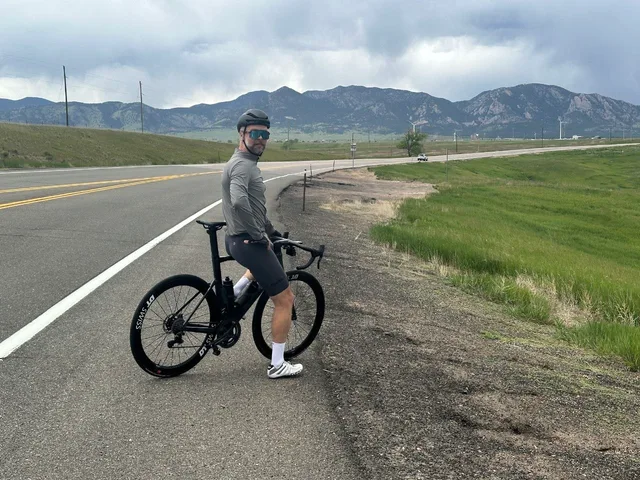 Dima with his road bike during a ride.